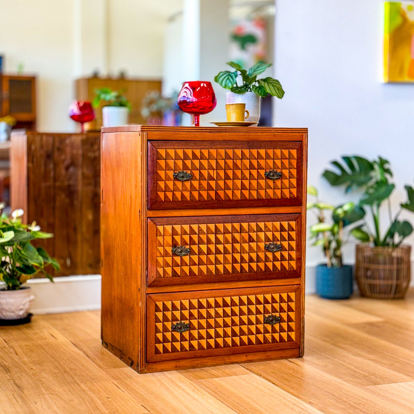 Marquetry chest of drawers featuring geometric design