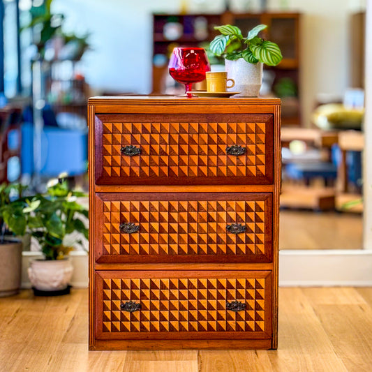 Marquetry chest of drawers featuring geometric design