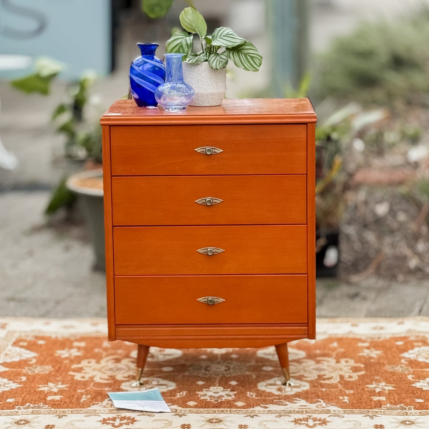 Retro chest of drawers on cigar legs