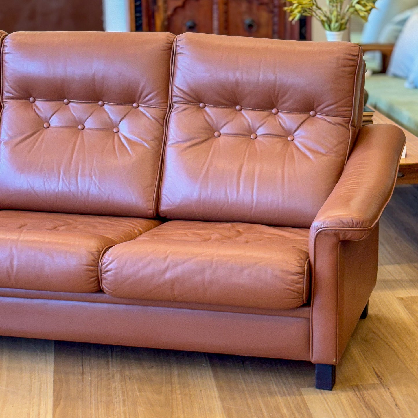 Leather upholstered three seater sofa