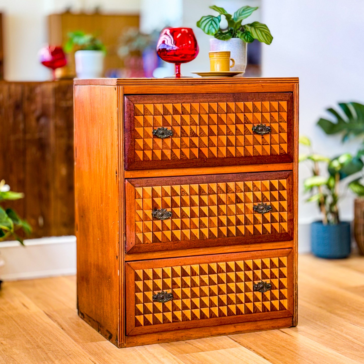 Marquetry chest of drawers featuring geometric design