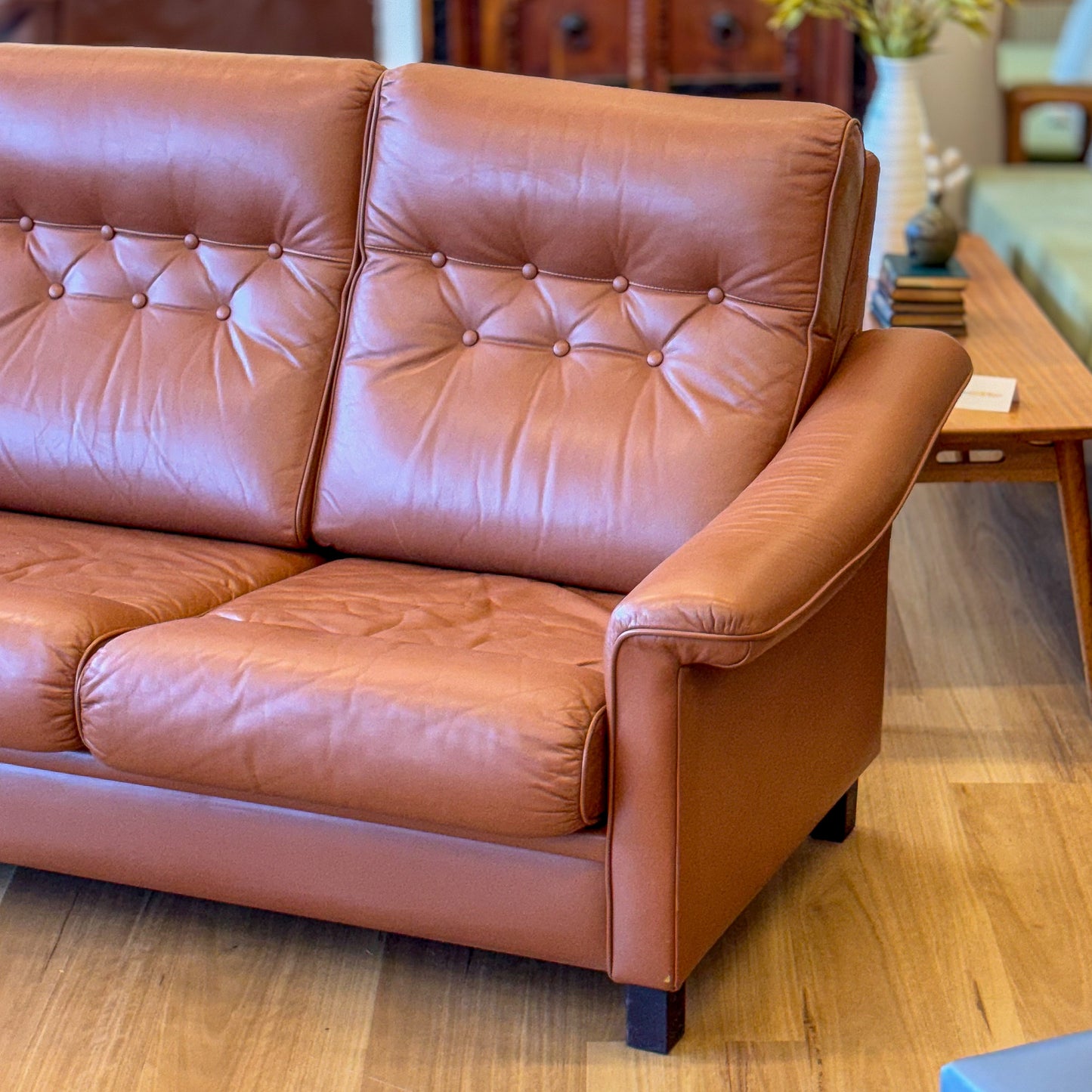 Leather upholstered three seater sofa