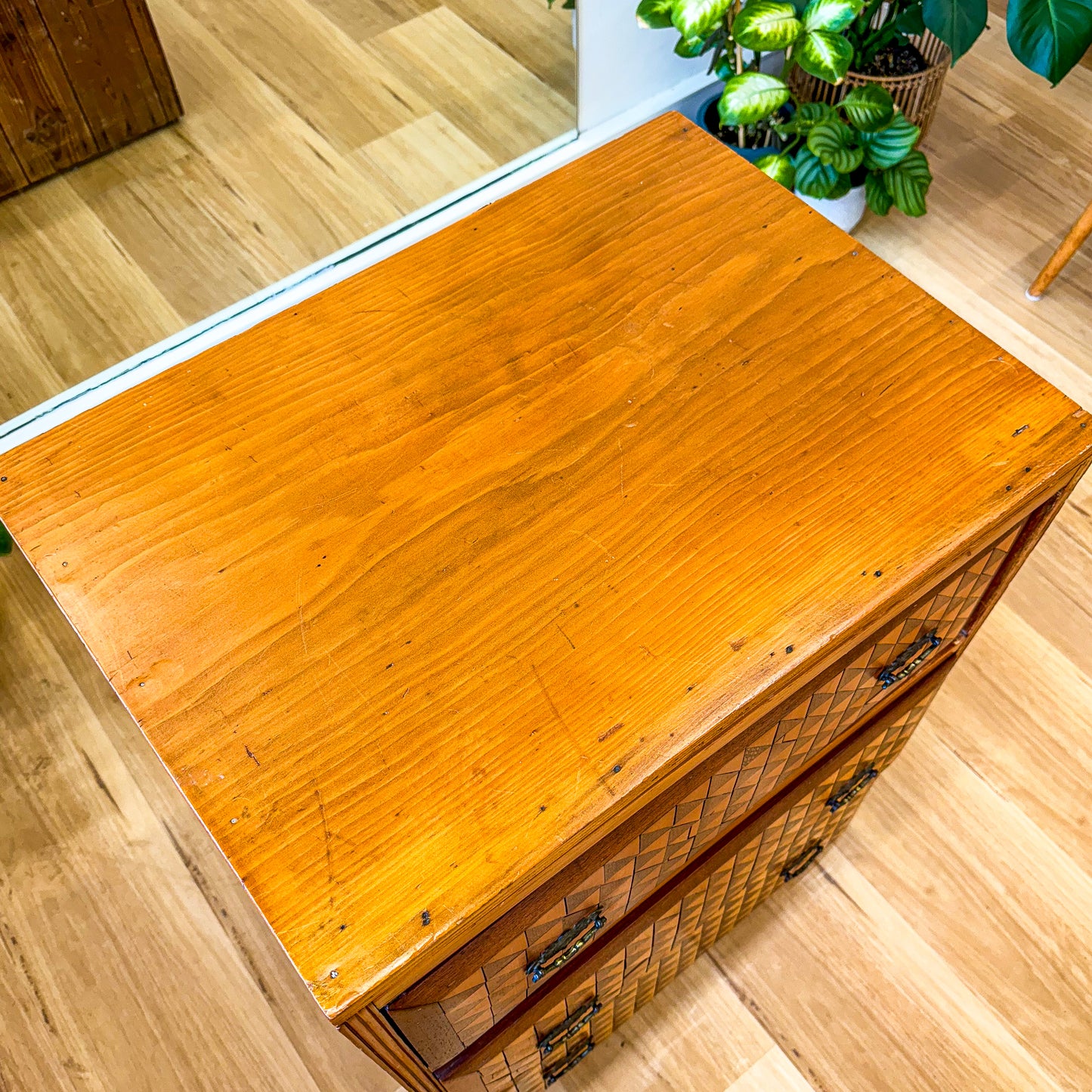 Marquetry chest of drawers featuring geometric design