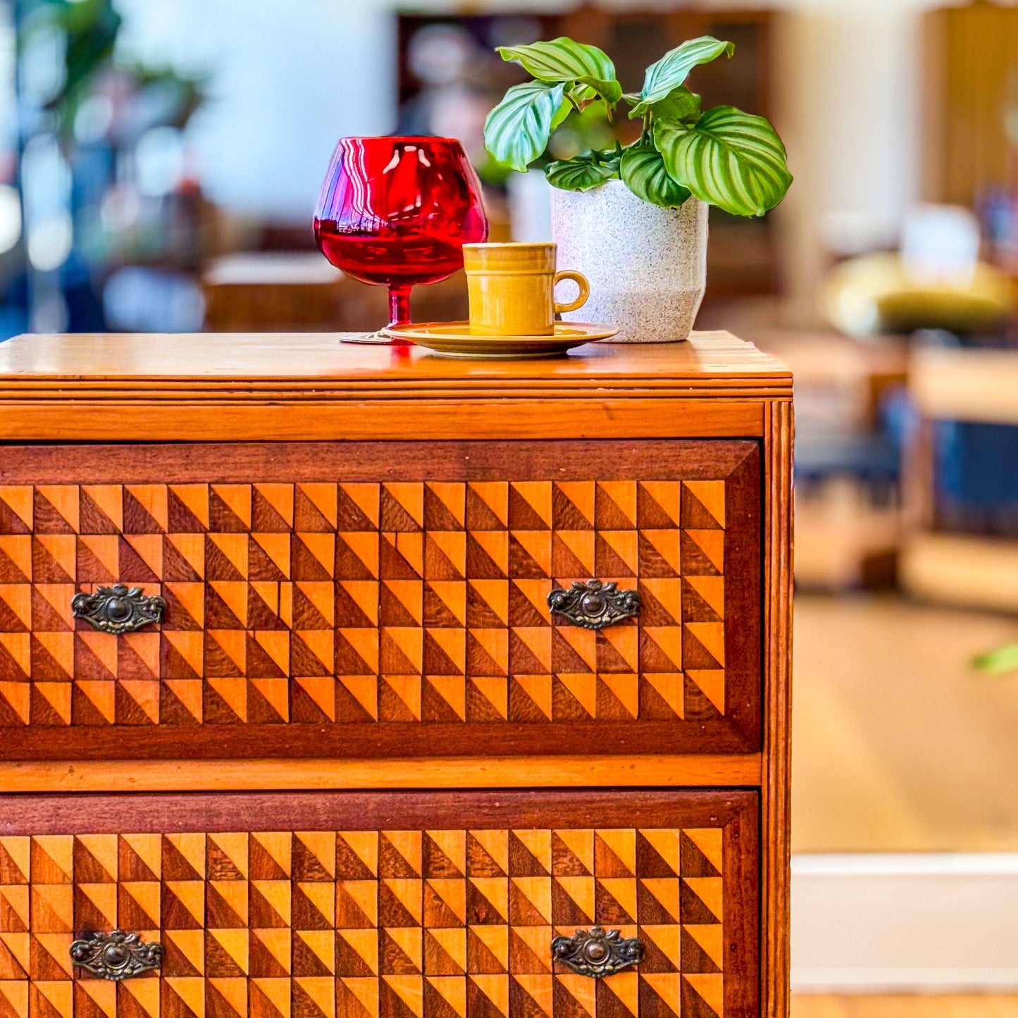 Marquetry chest of drawers featuring geometric design