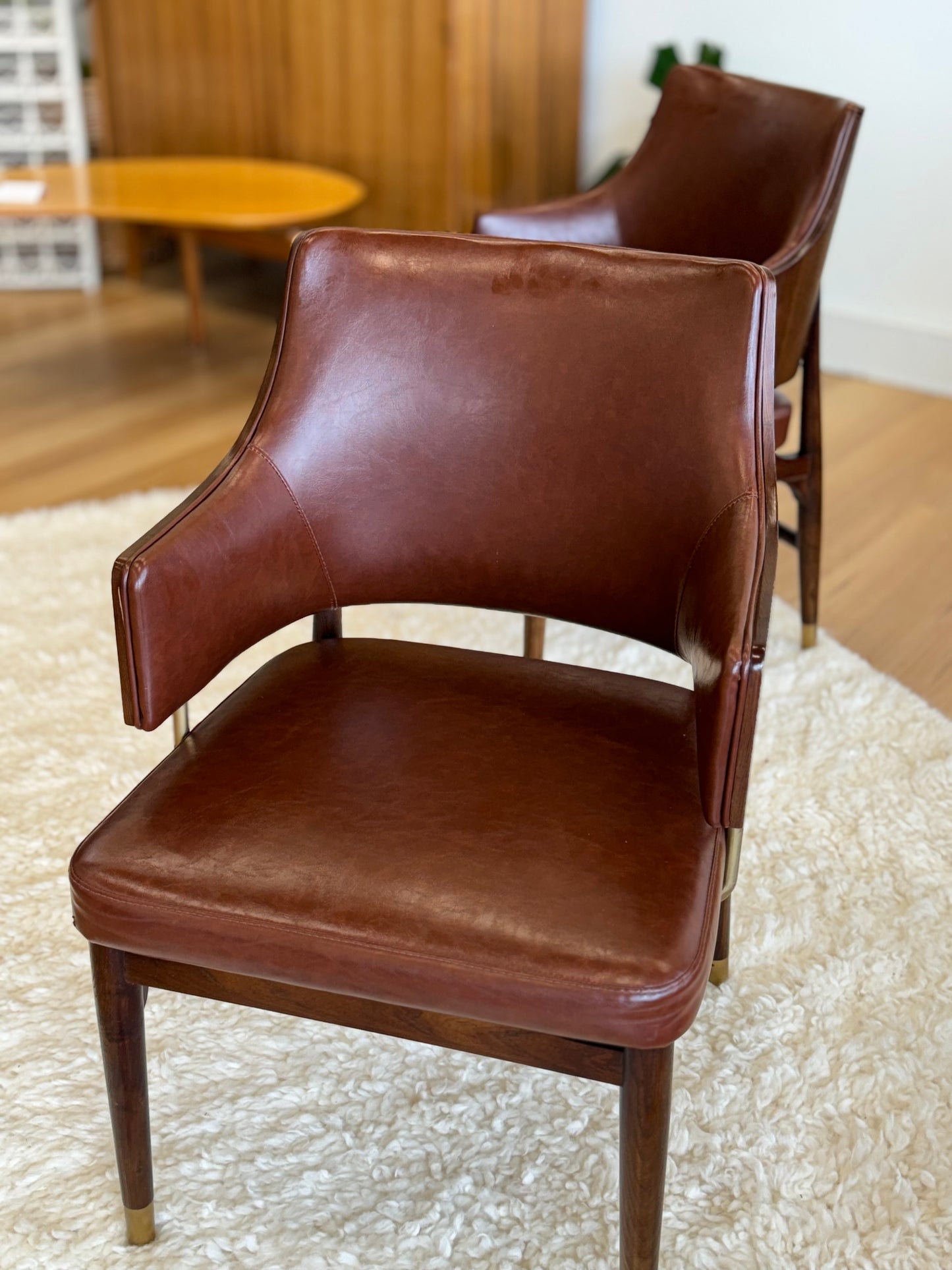 Pair Of Mid C20th Vinyl Upholstered Tub Chairs With Cigar Legs And Brass Accents