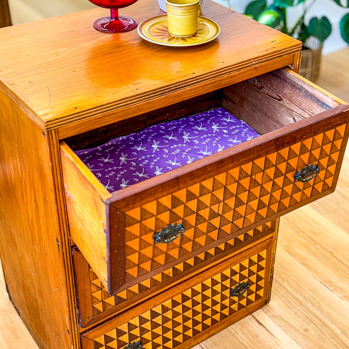 Marquetry chest of drawers featuring geometric design