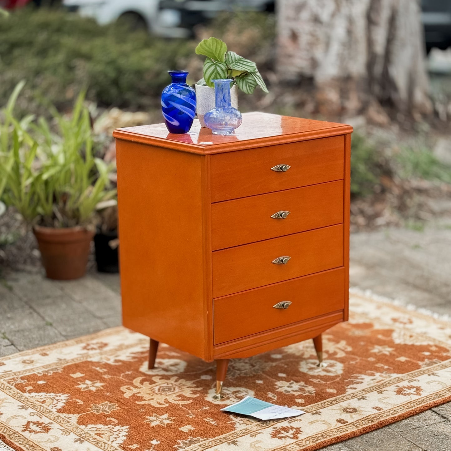 Retro chest of drawers on cigar legs