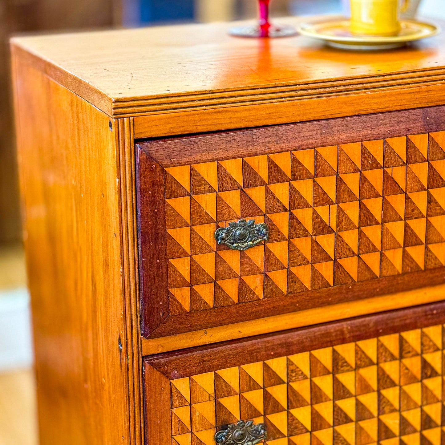 Marquetry chest of drawers featuring geometric design