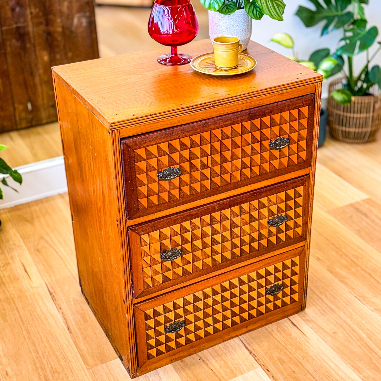 Marquetry chest of drawers featuring geometric design