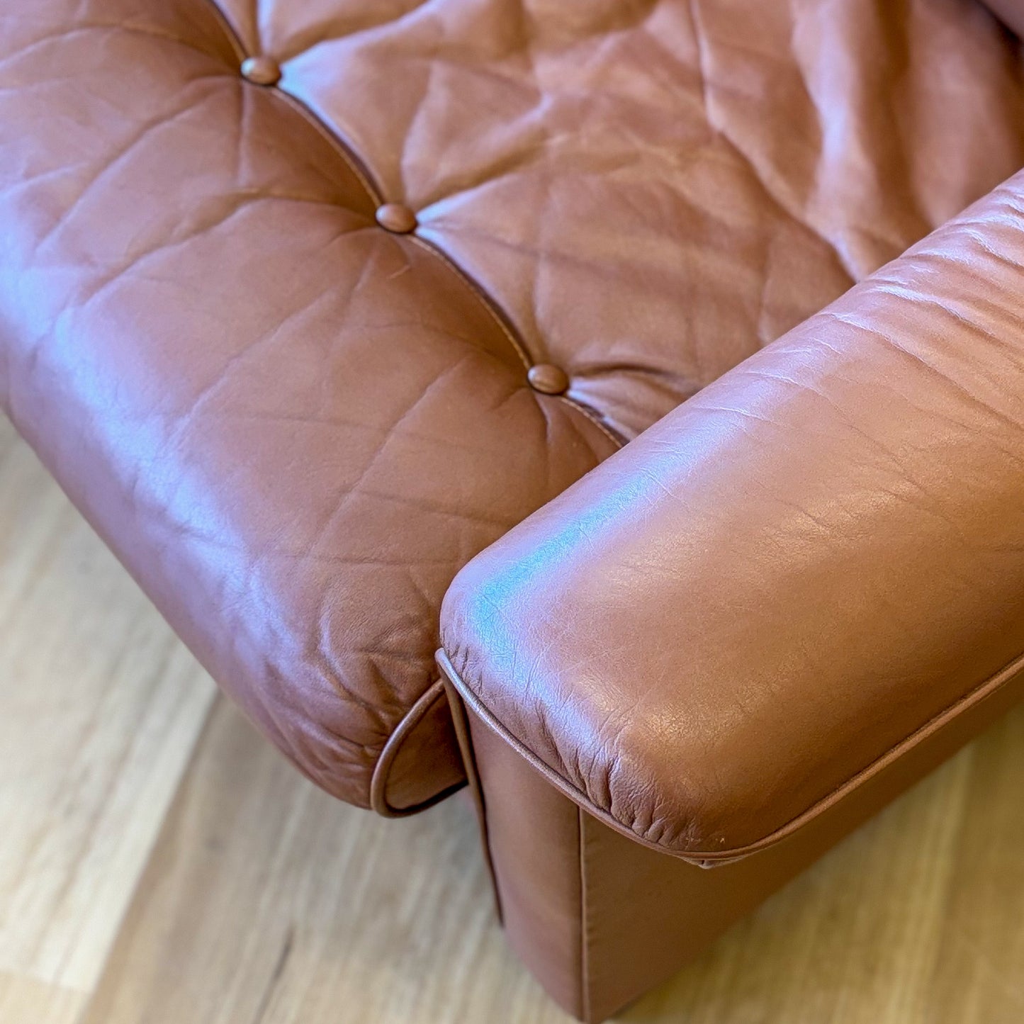 Leather upholstered three seater sofa