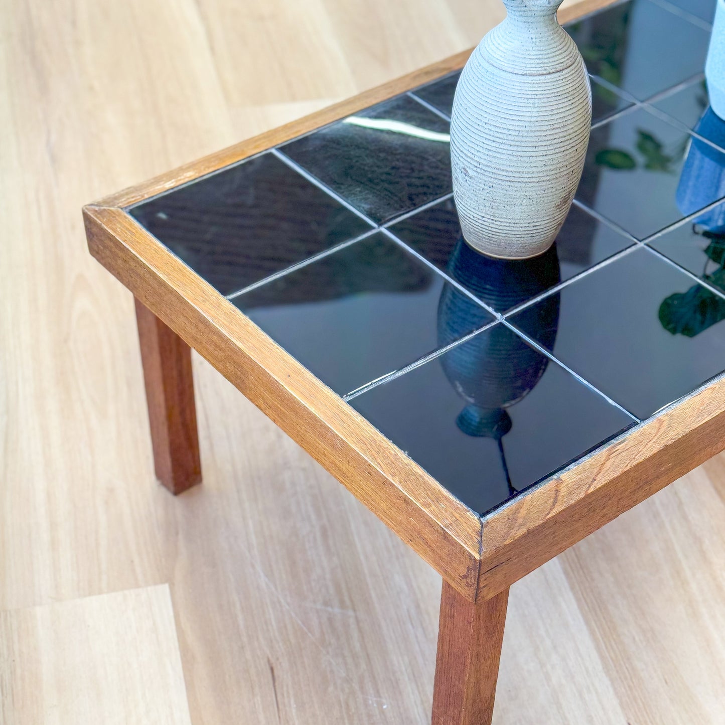 Black tiled top coffee table